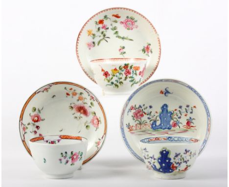 An early New Hall tea bowl and saucer with rock and fence decoration, a similar tea bowl and saucer and one other, pattern nu