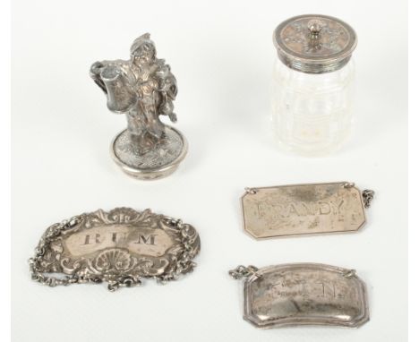 Two silver decanter labels, a plated label, a glass salt with plated top and a plated figure of a man holding a jug