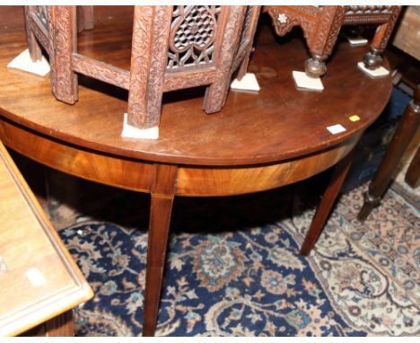 A 19th Century mahogany half round side table with double gate support