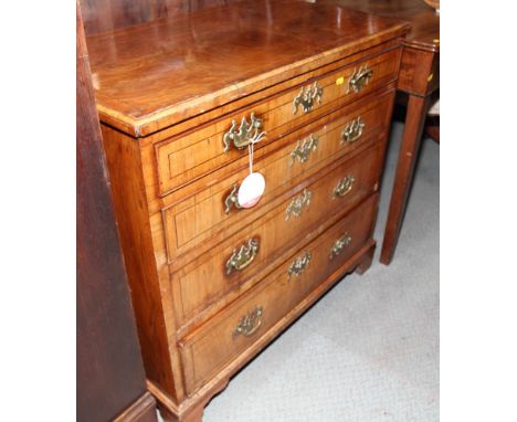 An 18th Century walnut and line inlaid chest of four long drawers fitted brass handles, on bracket supports, 32" wide