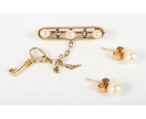 A gold bar brooch set pearls and pendant key and a pair of gold pearl set ear studs