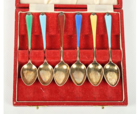 A cased set of silver gilt teaspoons with coloured enamel handles, a cased part set of mother-of-pearl handled tea knives and