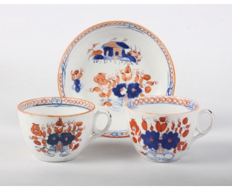 A New Hall bone china pattern 1084 tea cup and saucer with factory backstamp and a companion tea cup