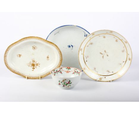 A New Hall pattern 195 bowl, two circular tea pot stands, patterns 52 and 336, and a shaped dish