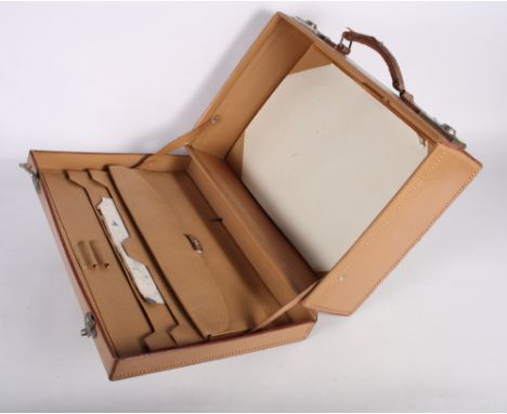 A leather writing case, a green painted strong box and a two-handled trunk