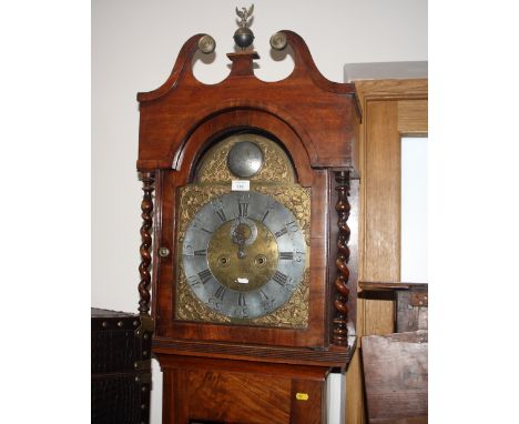A 19th Century mahogany long case clock with scroll pediment and spiral turned pilasters, eight-day movement with brass and s