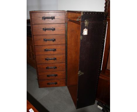 An oak lined wardrobe trunk, fitted drawers and hanging space
