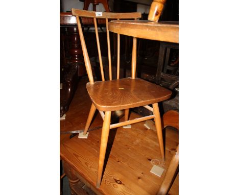 A pair of Ercol spindle back wooden dining chairs