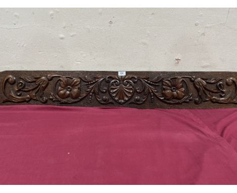 An oak panel, carved in relief with shell and foliage. 49' x 7½'