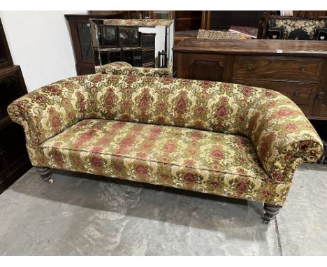 A Victorian chesterfield sofa on turned legs. 78' wide
