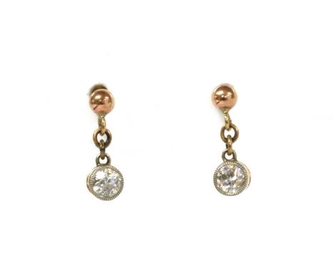 A pair of Edwardian gold diamond drop earrings, an old European cut diamond, milligrain set, joined by jump rings to a bead a