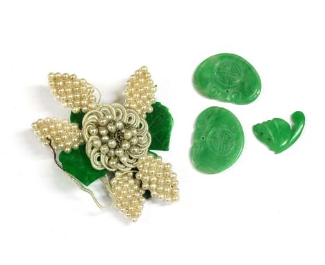 A seed pearl and jade flower, petals of seed pearls, some deficient, with carved jade leaves, one broken, together with some 