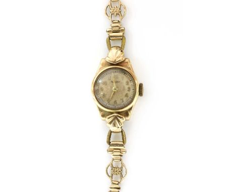 A ladies' 9ct gold Rotary mechanical bracelet watch, a silvered dial with Arabic numerals, to after market rolled gold bracel