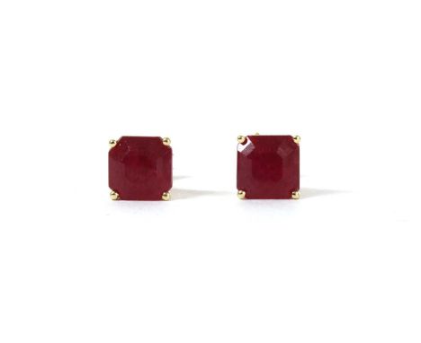 A pair of gold single stone fracture filled ruby stud earrings, with an octagonal mixed cut fracture filled ruby, approximate