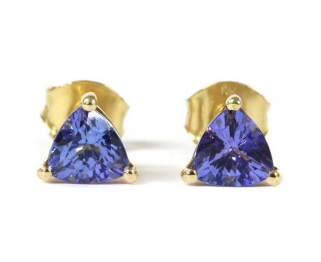 A pair of gold single stone tanzanite stud earrings, a triangular mixed cut tanzanite, approximately 5.5mm, claw set to post 