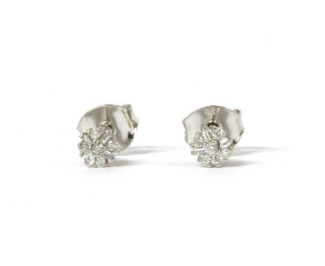 A pair of white gold diamond cluster stud earrings, a brilliant cut diamond to surround of alternating brilliant and baguette