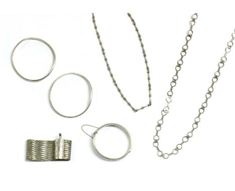 A quantity of silver jewellery, to include a sterling silver hollow oval half engraved hinged bangle, London 1959, a pair of 