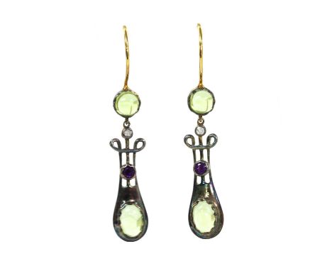 A pair of silver and gold, peridot, amethyst and diamond drop earrings, lyre shaped links each rub set to the bottom with an 