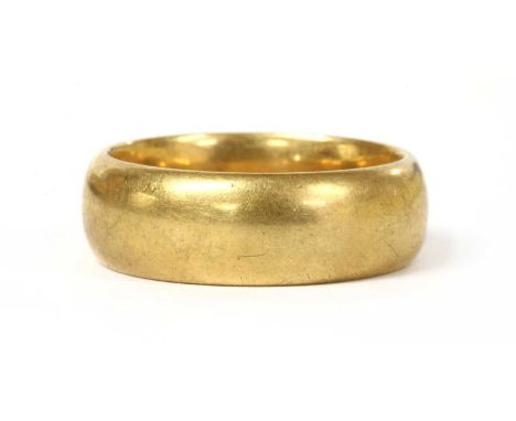 An 18ct gold light court section wedding ring, engraved to the inside 9th Dec 1908, London 1907, 7mm wide, 10.71g.Finger size