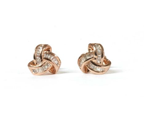 A pair of silver rose gilt diamond set stud earrings, in the form of a knot, channel set with baguette cut diamonds, to post 