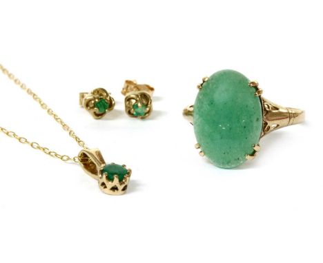 A gold single stone emerald pendant, suspended on a trace link chain, tested as approximately 9ct gold, together with a pair 