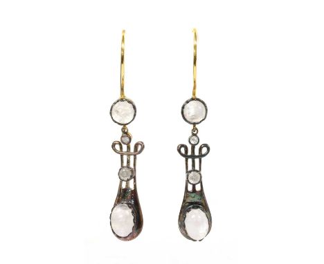 A pair of silver and gold, moonstone and diamond drop earrings, lyre shaped links each rub set to the bottom with an oval cab