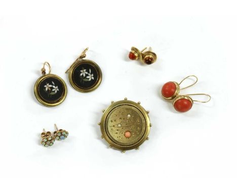 A Victorian gold coral and split pearl brooch, with beaded decoration, to pin, 'C' catch and glazed locket verso, tested as a