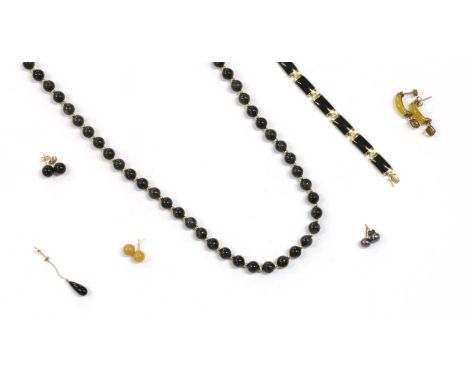 A quantity of gold hardstone jewellery, possibly dyed jade, to include a bead necklace with gold safety clasp, tested as appr