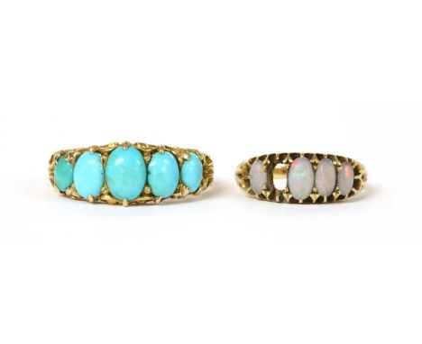 A Victorian gold five stone turquoise ring, with a row of graduated oval cabochon turquoise, claw set to scrolling gallery, w
