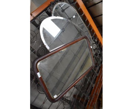 Three vintage bevelled glass wall mirrors in various frames.