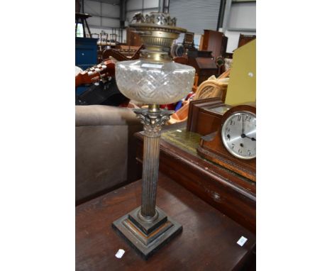A Corinthian column oil lamp