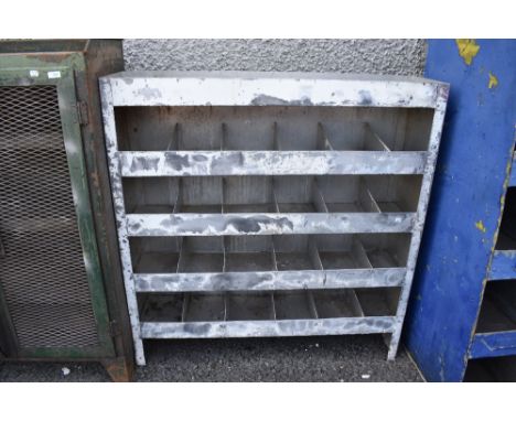 A 20th century metal cased industrial or garage shelf set