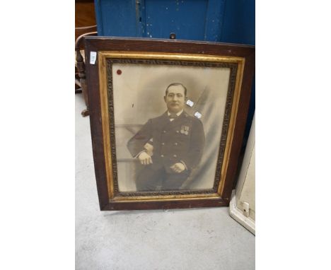 An early 20th century photographic print of a Naval or similar military officer