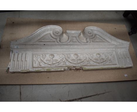 A late Georgian early Victorian architectural door cornice having scroll work design with laurel wreath. Composed of plaster 