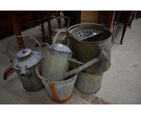 A collection of vintage metal ware to include watering cans, mop bucket, bucket and similar.