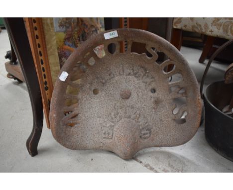 A vintage farm machinery implement or tractor seat marked Newark England