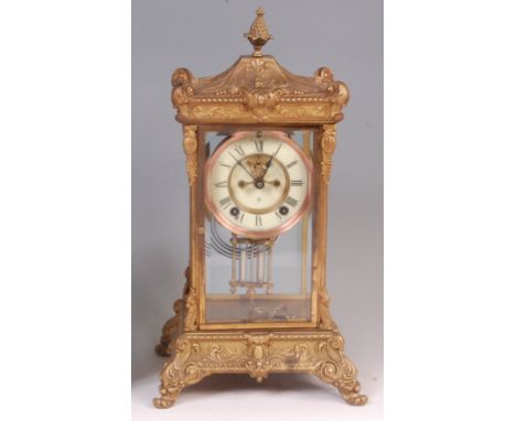 A circa 1900 Ansonia of New York brass cased four glass regulator mantel clock, the ornate case having signed white enamel di