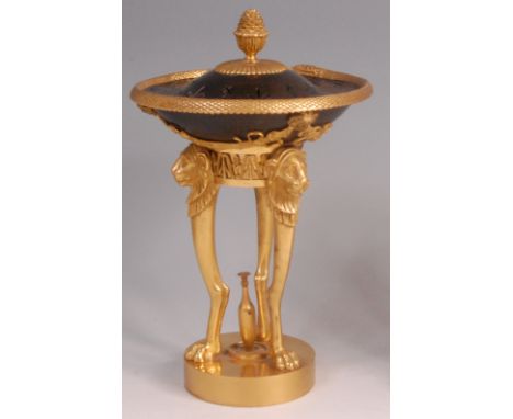 A 19th century French bronze and gilt bronze pot pourri and cover, the shallow bowl having finial top pierced cover, supporte