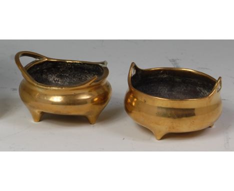 A Chinese polished bronze twin-handled censer, of small proportions, bears Xuande six character mark verso (one handle a/f), 