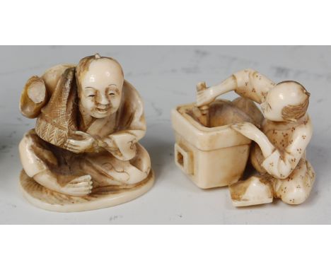 A Japanese Meiji period carved ivory netsuke, of a seated street vendor, signed in script verso, h.3.5cm; together with one o