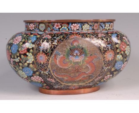 A 19th century Chinese cloisonné enamel jardiniere, of shaped oval form, centre set with opposing reserves of dragons, all wi