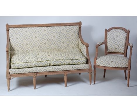 A Louis XVI style light oak three piece salon suite, comprising; two seater canapé and a pair of open fauteuils, each with cr