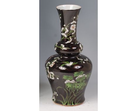 A Chinese stoneware double gourd vase, enamel decorated with blossom and birds on a black ground, h.30cm  Condition Report / 