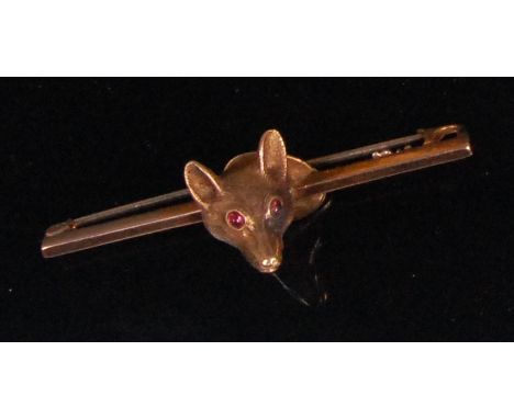 A continental yellow metal bar brooch, centre set with a foxes head, having ruby set eyes, apparently unmarked, untested, 5.9