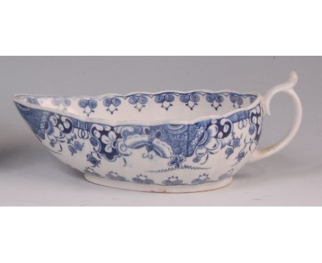 An 18th century Worcester porcelain sauceboat, of ribbed pear shape, underglaze blue decorated with a chinoisserie landscape 