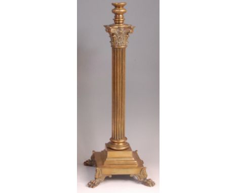 A Victorian brass Corinthian column table lamp base, on stepped square base on lion paw feet (lacking reservoir and shade), h