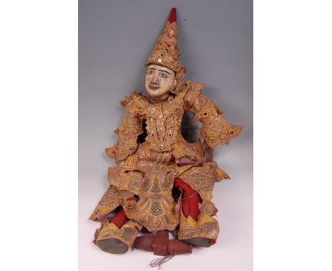A Burmese Yoke Thé marionette string puppet of Tha Gyar Min, wearing traditional gold sequinned and jewelled cotton and silk 