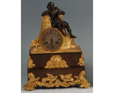 A circa 1830 French ormolu and patinated bronze mantel clock, modelled as a Scottish Highlander in traditional dress and lean