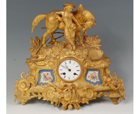 A mid-19th century French gilt metal and porcelain mounted figural mantel clock, in the Rococo style, the case extensively de