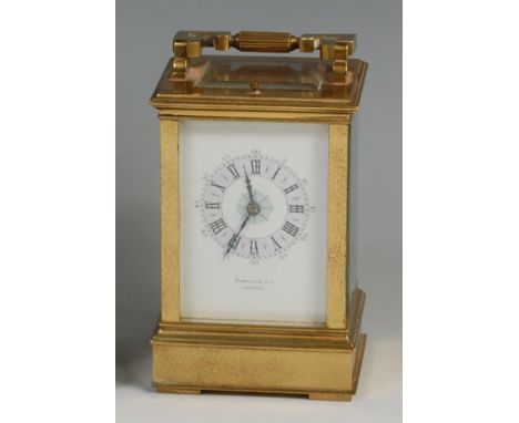 A late 19th century French lacquered brass carriage clock, signed to the white enamel dial by the retailer Hamilton & Co of C